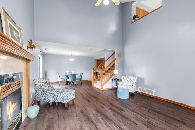 7954 Timber Lake Dr, Eden Prairie, MN 55347 - sitting room with stairway, a fireplace, wood finished floors, and a high ceiling