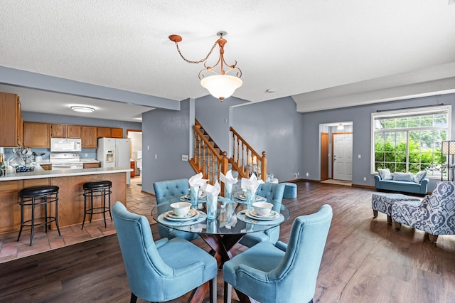 7954 Timber Lake Dr, Eden Prairie, MN 55347 - dining room featuring stairs and dark wood-style floors
