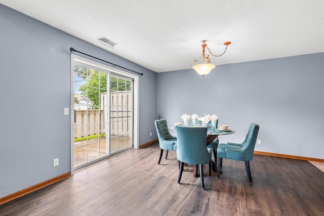 7954 Timber Lake Dr, Eden Prairie, MN 55347 - dining area with wood finished floors and a textured ceiling