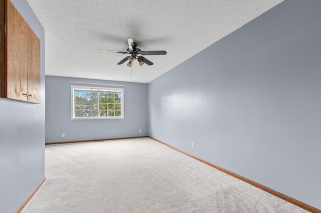 7954 Timber Lake Dr, Eden Prairie, MN 55347 - carpeted spare room with a ceiling fan, a textured ceiling, and vaulted ceiling
