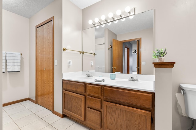 7954 Timber Lake Dr, Eden Prairie, MN 55347 - full bath with double vanity, a textured ceiling, and tile patterned floors