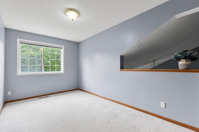 7954 Timber Lake Dr, Eden Prairie, MN 55347 - carpeted empty room featuring a textured ceiling and baseboards