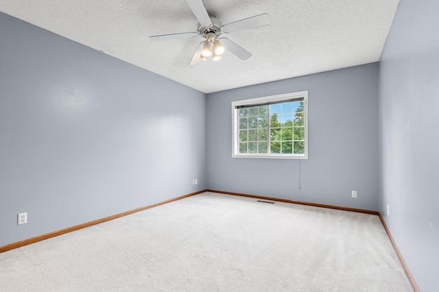 7954 Timber Lake Dr, Eden Prairie, MN 55347 - spare room featuring a textured ceiling, carpet, and a ceiling fan