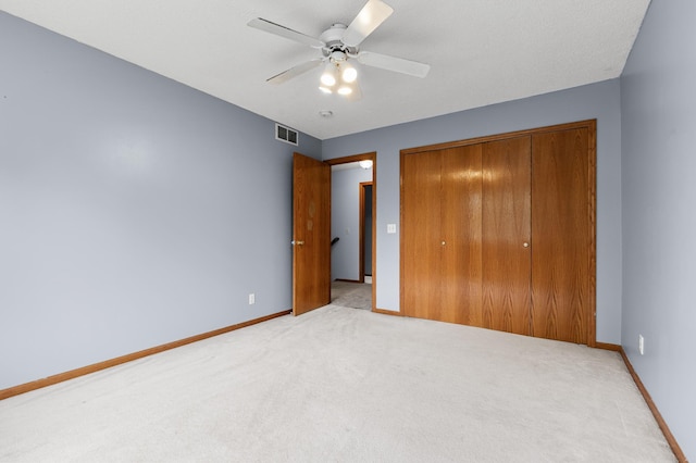 7954 Timber Lake Dr, Eden Prairie, MN 55347 - unfurnished bedroom featuring carpet, a closet, and a ceiling fan