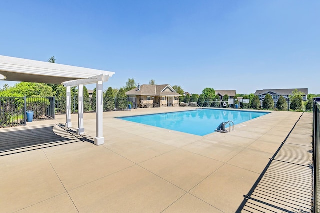 community pool with a patio, fence, and a pergola