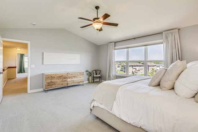 bedroom with lofted ceiling, carpet, ceiling fan, and baseboards