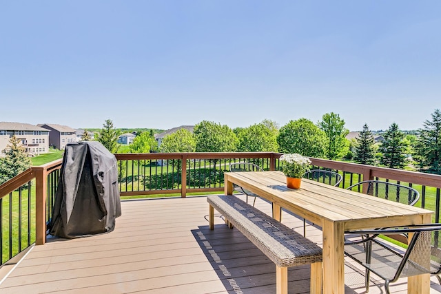 wooden terrace with outdoor dining area