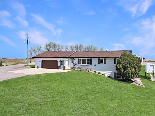 2216 County Road 15, Russell, MN 56169 - ranch-style home featuring concrete driveway, a garage, and a front lawn