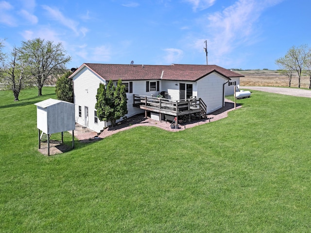 2216 County Road 15, Russell, MN 56169 - back of property featuring a deck, a yard, and roof with shingles