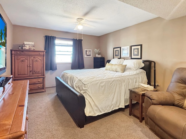 2216 County Road 15, Russell, MN 56169 - bedroom featuring light colored carpet, a textured ceiling, and a ceiling fan