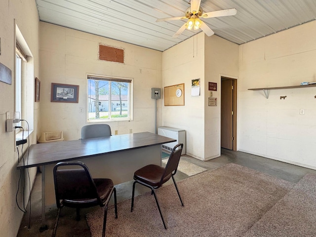 2216 County Road 15, Russell, MN 56169 - home office featuring concrete floors, ceiling fan, and vaulted ceiling