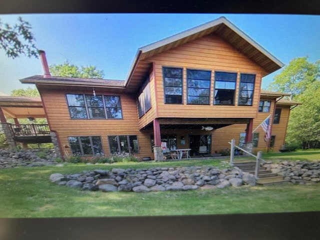 10115 Island Lake Rd, Solon Springs, WI 54873 - rear view of house featuring a yard and stairs