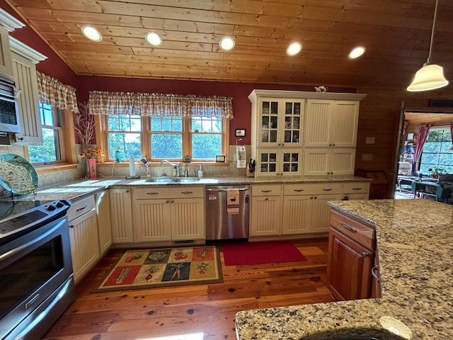 10115 Island Lake Rd, Solon Springs, WI 54873 - kitchen with appliances with stainless steel finishes, recessed lighting, dark wood finished floors, a sink, and lofted ceiling