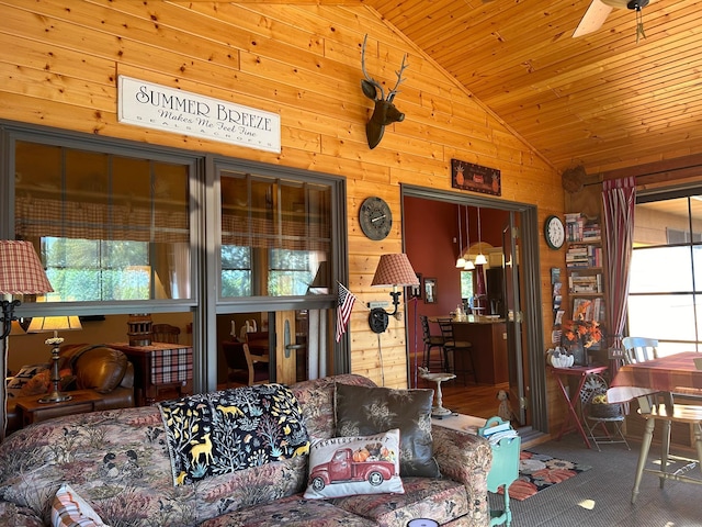 10115 Island Lake Rd, Solon Springs, WI 54873 - living room featuring wooden walls, wood ceiling, carpet floors, high vaulted ceiling, and a ceiling fan