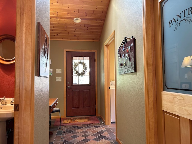 10115 Island Lake Rd, Solon Springs, WI 54873 - doorway to outside with vaulted ceiling, baseboards, a textured wall, and wood ceiling