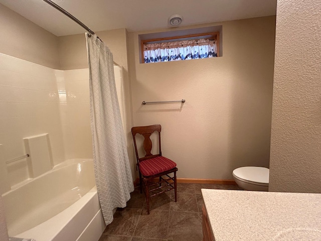 10115 Island Lake Rd, Solon Springs, WI 54873 - full bath with vanity, toilet, shower / bath combo, baseboards, and tile patterned flooring