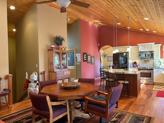10115 Island Lake Rd, Solon Springs, WI 54873 - dining space featuring light wood-style floors, wooden ceiling, a ceiling fan, high vaulted ceiling, and recessed lighting