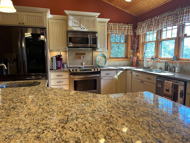 10115 Island Lake Rd, Solon Springs, WI 54873 - kitchen with appliances with stainless steel finishes, a sink, wood ceiling, light stone countertops, and cream cabinets