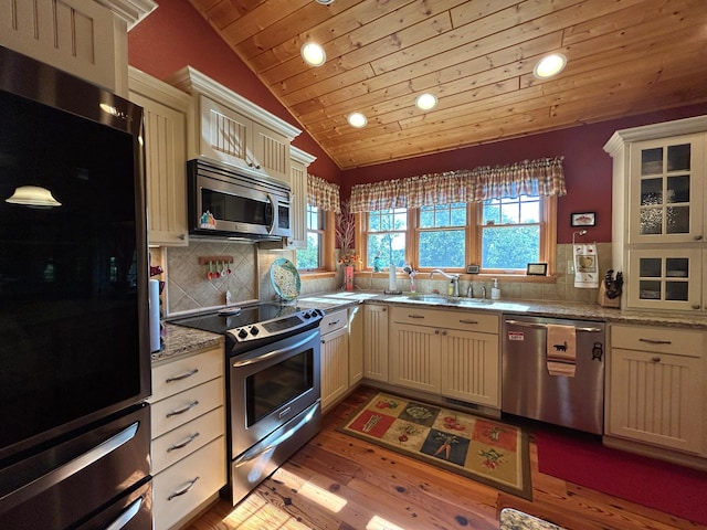 10115 Island Lake Rd, Solon Springs, WI 54873 - kitchen with stainless steel appliances, recessed lighting, wooden ceiling, a sink, and lofted ceiling