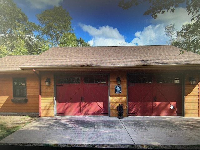 10115 Island Lake Rd, Solon Springs, WI 54873 - view of front of property featuring a garage and a shingled roof