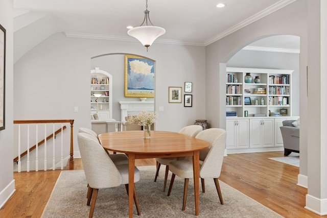 490 Old Long Lake Rd, Orono, MN 55391 - dining room featuring light wood-type flooring, arched walkways, ornamental molding, baseboards, and recessed lighting
