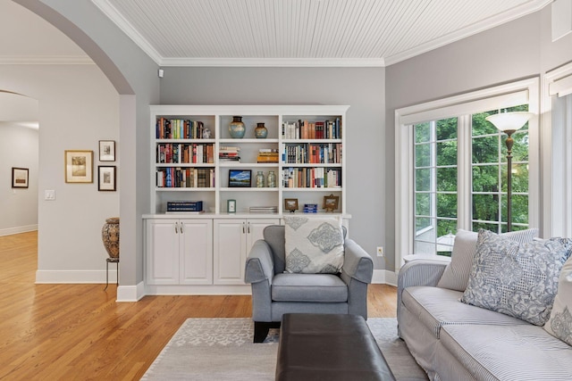 490 Old Long Lake Rd, Orono, MN 55391 - sitting room featuring arched walkways, light wood finished floors, crown molding, and baseboards