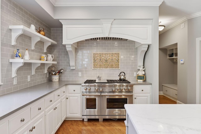 490 Old Long Lake Rd, Orono, MN 55391 - kitchen with range with two ovens, open shelves, backsplash, light wood finished floors, and white cabinets
