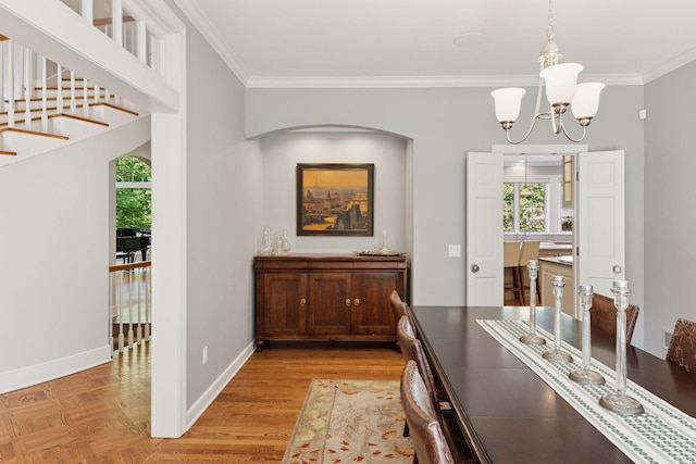 490 Old Long Lake Rd, Orono, MN 55391 - dining space featuring a chandelier, crown molding, baseboards, parquet floors, and arched walkways