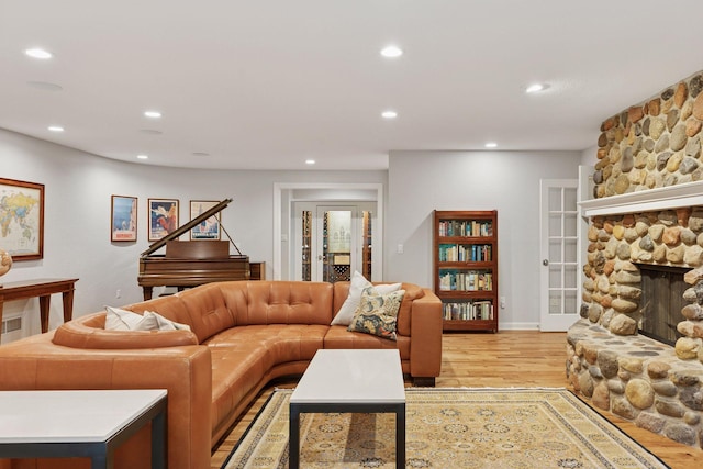490 Old Long Lake Rd, Orono, MN 55391 - living room featuring light wood finished floors, recessed lighting, a stone fireplace, and baseboards