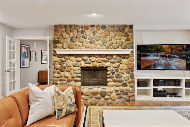 490 Old Long Lake Rd, Orono, MN 55391 - living room featuring a stone fireplace and wood finished floors