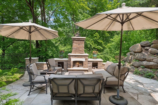 490 Old Long Lake Rd, Orono, MN 55391 - view of patio with an outdoor living space with a fireplace and view of wooded area