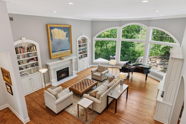490 Old Long Lake Rd, Orono, MN 55391 - living room featuring healthy amount of natural light, recessed lighting, built in features, and ornamental molding