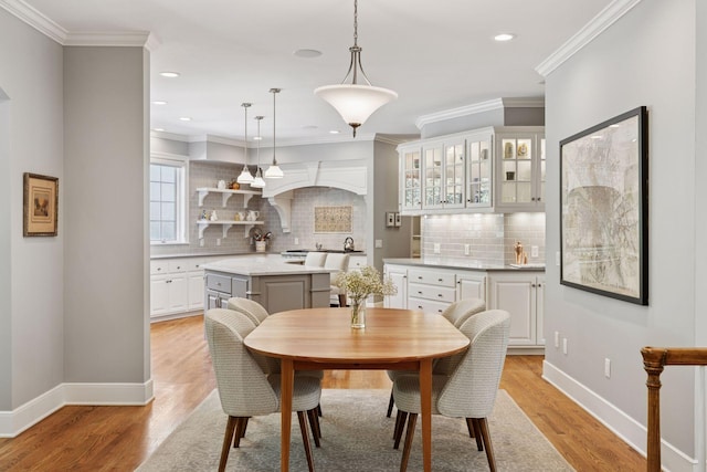 490 Old Long Lake Rd, Orono, MN 55391 - dining space with light wood-type flooring, recessed lighting, and crown molding