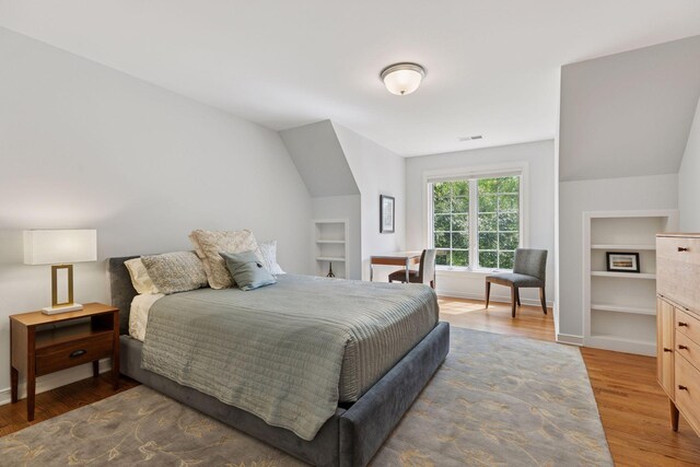 490 Old Long Lake Rd, Orono, MN 55391 - bedroom with wood finished floors and lofted ceiling