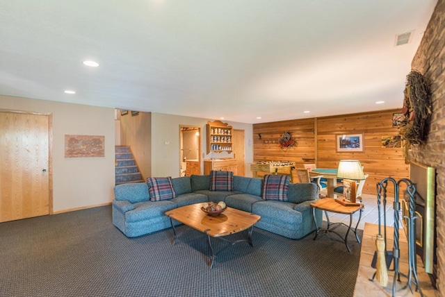 8744 Interlachen Rd, Lake Shore, MN 56468 - carpeted living area featuring recessed lighting, wooden walls, stairway, a fireplace, and baseboards