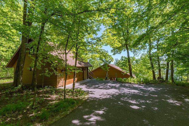 8744 Interlachen Rd, Lake Shore, MN 56468 - view of property exterior with driveway and a garage