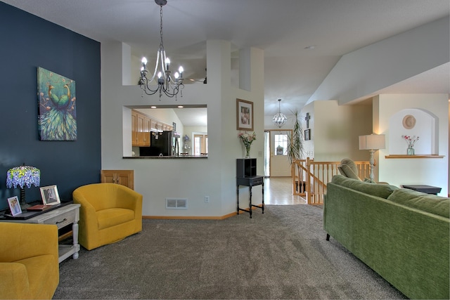 910 Shady Ridge Ln, Braham, MN 55006 - living area featuring a chandelier, carpet floors, lofted ceiling, and baseboards