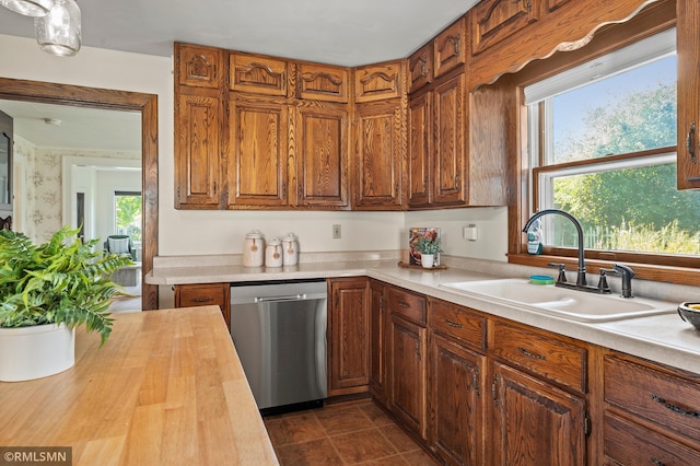 920 2nd St S, Stillwater, MN 55082 - kitchen with stainless steel dishwasher, wood counters, and brown cabinetry