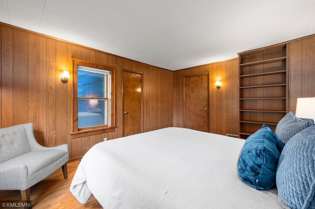 920 2nd St S, Stillwater, MN 55082 - bedroom with wooden walls and light wood finished floors