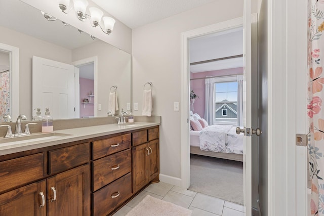 62 Rapp Farm Blvd, North Oaks, MN 55127 - full bathroom featuring double vanity, ensuite bath, tile patterned flooring, and baseboards