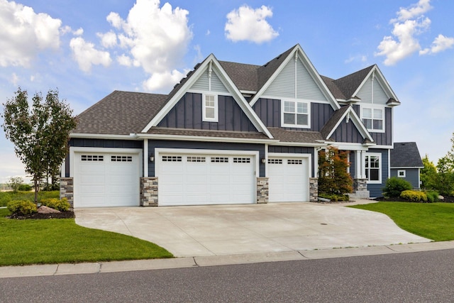 62 Rapp Farm Blvd, North Oaks, MN 55127 - craftsman-style house with board and batten siding, driveway, stone siding, and a front yard