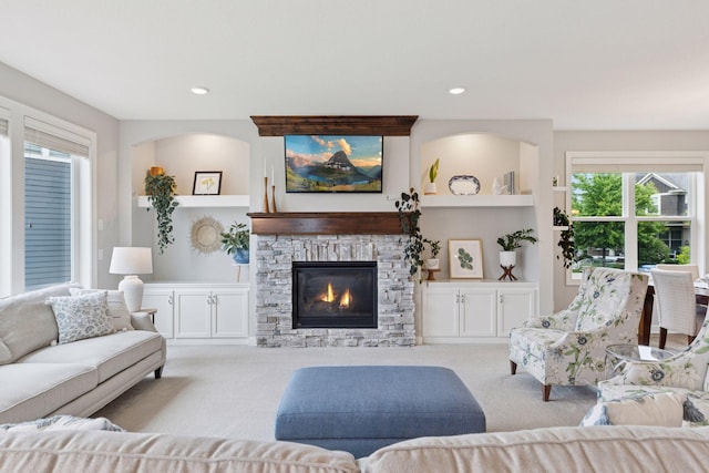 62 Rapp Farm Blvd, North Oaks, MN 55127 - living area with carpet floors, a fireplace, plenty of natural light, and recessed lighting
