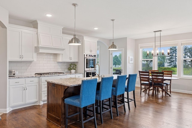 62 Rapp Farm Blvd, North Oaks, MN 55127 - kitchen featuring appliances with stainless steel finishes, decorative backsplash, white cabinetry, and recessed lighting