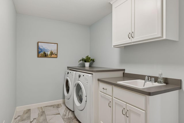 62 Rapp Farm Blvd, North Oaks, MN 55127 - laundry area featuring washer and dryer, light marble finish floors, and cabinet space
