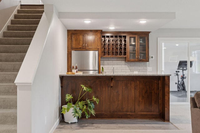 62 Rapp Farm Blvd, North Oaks, MN 55127 - indoor wet bar with freestanding refrigerator, stairs, decorative backsplash, and recessed lighting