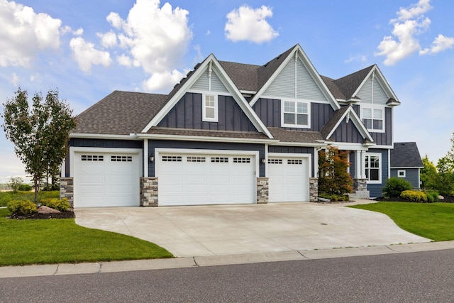 62 Rapp Farm Blvd, North Oaks, MN 55127 - craftsman house with board and batten siding, driveway, stone siding, and a front lawn