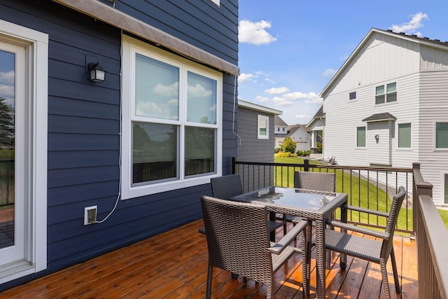 62 Rapp Farm Blvd, North Oaks, MN 55127 - wooden terrace with outdoor dining area and a residential view