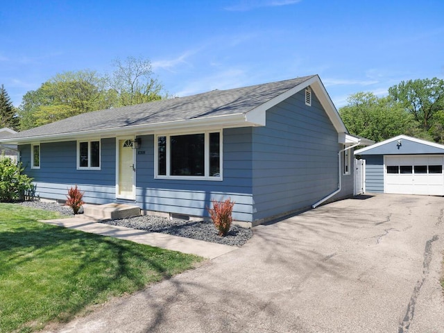 10308 Belmont Rd, Minnetonka, MN 55305 - ranch-style house with a garage, an outdoor structure, asphalt driveway, a front lawn, and a shingled roof