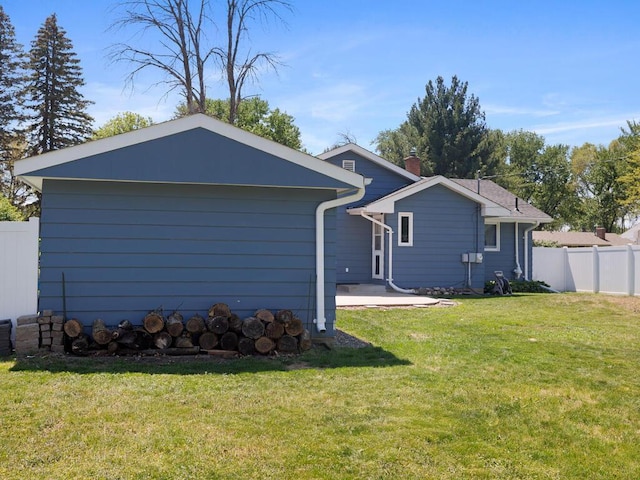 10308 Belmont Rd, Minnetonka, MN 55305 - back of property with a patio and a chimney