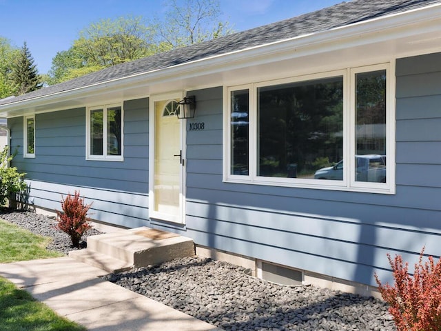 10308 Belmont Rd, Minnetonka, MN 55305 - doorway to property featuring roof with shingles